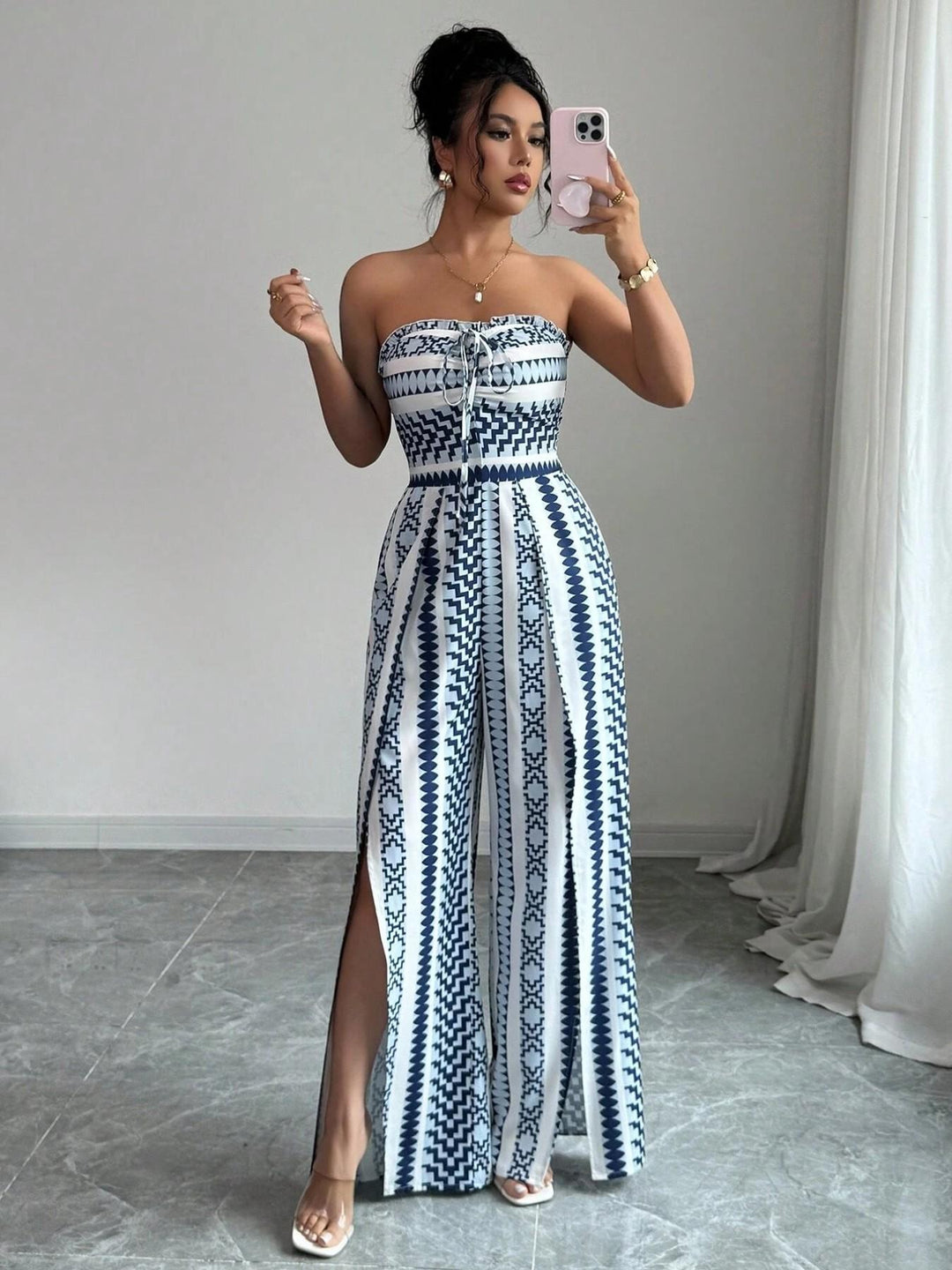 👗 50% OFF NOW! 💥 Geometric Jumpsuit with Halter Neckline & Side Slit – Unique print & elastic back – Versatile, perfect for summer parties or resort wear ✨